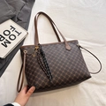 Dark brown tote bag with vintage pattern and decorative charms on a blazer backdrop - With Pendant / Brown