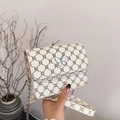 Chic beige square crossbody bag featuring vintage pattern and white butterfly clasp - Off White