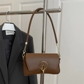 Bruine vintage crossbodytas van kunstleer met een gouden ronde sluiting en ketting - Bruin