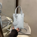 Light blue minimalist PU leather mini tote bag with cute dog charm and shoulder strap - Blue