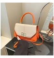 Detailed close-up of the interlocking metal buckle and two-tone texture on the handbag - Orange
