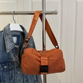 Rust orange nylon crossbody bag with adjustable strap and plastic buckle closure - Orange