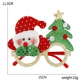 Christmas party glasses with Santa and green tree motifs, dimensions 15cm by 11.5cm - Red Face Snowman Tree Glasses