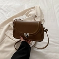 Deep brown leather crossbody square bag with silver heart lock and sleek shoulder strap - Brown