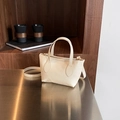 Chic cream white bucket bag in lychee pattern leather with golden metal hardware - Off White