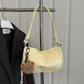 Vibrant yellow faux leather underarm bag with cute plush bear charm and knotted strap - Yellow