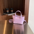Minimalist purple lychee leather bucket bag with top handles and shoulder strap - Purple