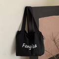 Borsa tote in tela nera minimalista con coulisse e stampa scritta bianca chic - Nero
