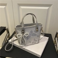 Minimalist light gray bucket bag with silver butterfly print and pearl bow charm - With Pearl Bow Pendant / Silver