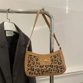 Leopard print underarm bag with a gold bow buckle and brown leather trim detailing - Khaki