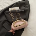 Pink glossy pillow bag with a chunky gold metal handle and fine chain shoulder strap - Pink
