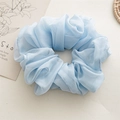 Detailed view of light blue chiffon scrunchie with layered pleats and airy texture - Blue