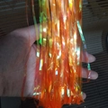 Iridescent orange foil fringe curtain for festive party background decorations - Candy Orange