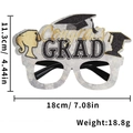 Close-up of graduation party glasses with gold Congrats lettering and black GRAD details - Double Portrait Grad Style