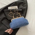 Light blue denim clutch bag with textured fabric, gold clasp and delicate chain strap - Blue