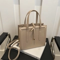 Minimalist beige structured tote bag with top handles and adjustable shoulder strap - Khaki
