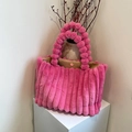 Chic pink faux fur tote bag with plush pom-pom handles and striped texture - Rose Red
