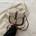 White vintage saddle bag with brown leather trim and golden clasp in casual style - White