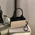 Minimalist black and beige contrasting leather handbag with stylish knot top handles - Black