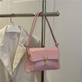 Elegant pink crocodile pattern crossbody bag with a horseshoe metal buckle and knotted strap - Pink