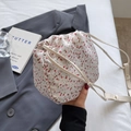 Mini white bucket bag with pink floral print and drawstring closure for women - Off White