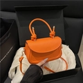 Orange crossbody bag with woven knot handle and golden hardware in luxury gift box - Orange
