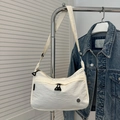Creamy white nylon crossbody bag with adjustable strap and metallic logo detail - White