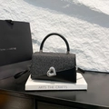Borsa nera con paillettes, serratura a cuore argento e manico in pelle su espositore - Nero