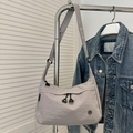 Light gray nylon crescent crossbody bag with adjustable strap and front zipper pocket - Gray