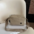 Khaki pleated nylon crossbody bag with compact square shape and adjustable strap - Khaki