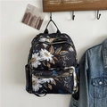 Damen Rucksack in Schwarz mit Gänseblümchen-Muster und praktischen Reißverschlussfächern - Blume