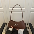 Minimalist brown underarm bag with silver bow detail and sleek crescent design - Brown