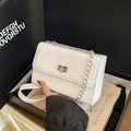 White faux crocodile skin crossbody bag with silver chain strap and metal turn-lock - White