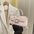 Detail of light pink patent leather mini square bag with pearl bow and lace charm - Pink With Pendant