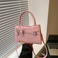 Pink crossbody bag with a sweet bow and top handle in smooth PU leather finish - Pink