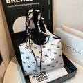 Minimalist white tote bag with black polka dots and stylish cloud-shaped pleated handles - White