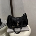 Minimalist black patent leather underarm bag with glossy finish and gold metal hook - Black