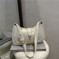 Pearlescent cream underarm bag with gold metal buckle and sleek crossbody strap - White