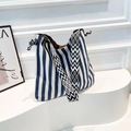 Navy blue and white striped canvas tote bag with geometric pattern woven shoulder strap - Blue