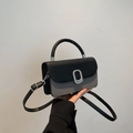 Mini-Handtasche aus schwarzem Leder und grauem Stoff mit silbernem Metallverschluss - Schwarz