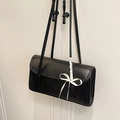 Minimalist black rectangular shoulder bag with white bow accent and long dual straps - Black