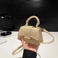 Mini beige textured woven handbag with crossbody strap and gold metal hardware detail - Khaki