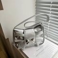 Silver metallic shoulder bag with pleated bow design and chic bow buckle detail - Silver