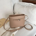Chic beige bucket shoulder bag with adjustable strap and decorative metal buckle detail - Khaki