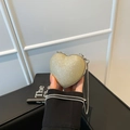 Sparkly gold heart-shaped mini crossbody bag with a slim silver metal chain strap - Gold