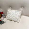 Chic white plush clutch with embossed 3D heart pattern and metallic zipper closure - White