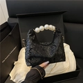 Black snake-patterned hobo bag featuring luxury pearl handle and metallic chain strap - Black