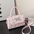 Light pink bow-knot crossbody bag with black mini butterfly prints and褶皱 texture - Pink