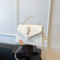 White snakeskin embossed crossbody bag with golden hardware and top handle for women - White