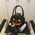 Halloween pumpkin shoulder bag in black PU leather with orange spiderweb stitching - Black & Orange